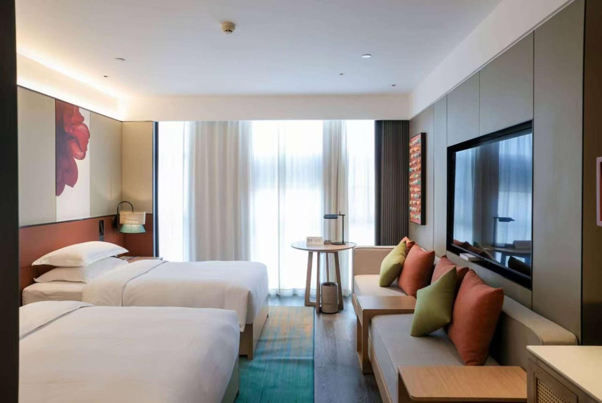 Hotel Ramada Yiyang Taojiang Esterno foto
