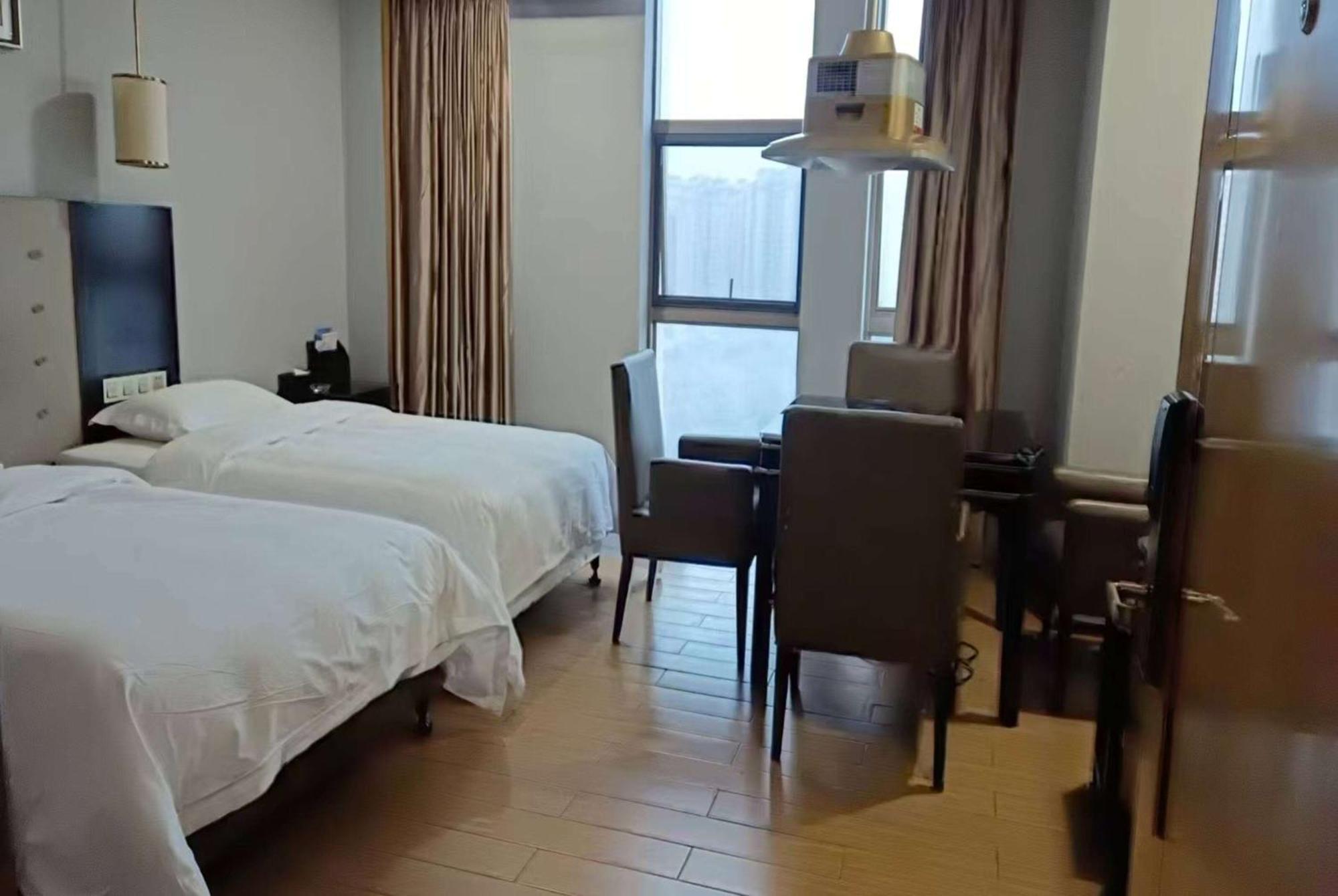 Hotel Ramada Yiyang Taojiang Esterno foto